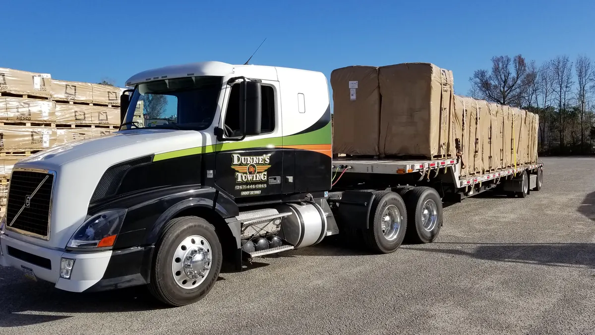 Dunne&rsquo;s flatbed hauling a load of freight