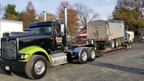 Lowboy trailer equipment transport near Skippack, PA