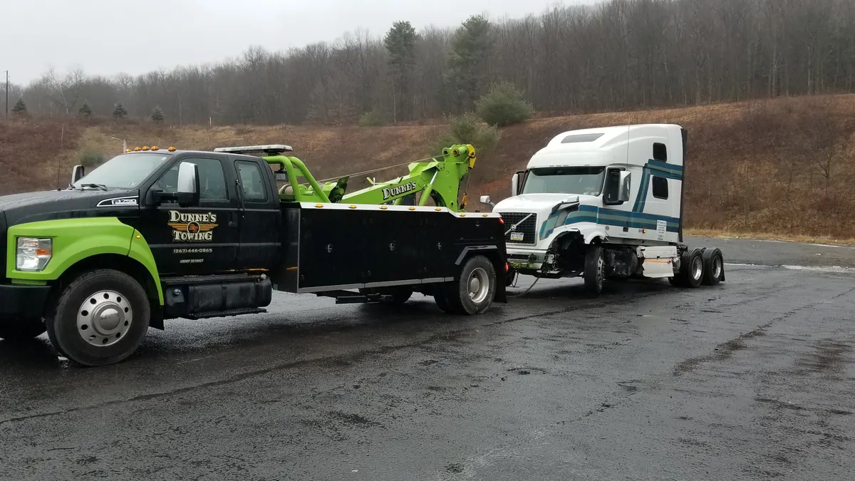 Dunne&rsquo;s wrecker towing a semi cab
